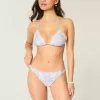 Braguita de bikini atrevida con doble tirante y ribete estilo crochet Braguita de bikini atrevida con doble tirante y ribete estilo crochet