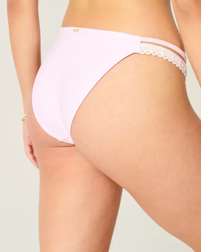 Braguita de bikini atrevida con doble tirante y ribete estilo crochet Braguita de bikini atrevida con doble tirante y ribete estilo crochet