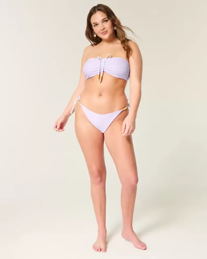 Braguita de bikini atrevida con lazo lateral reversible Braguita de bikini atrevida con lazo lateral reversible