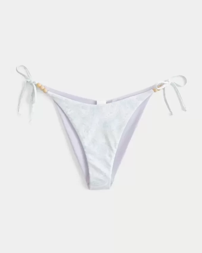 Braguita de bikini atrevida con lazo lateral reversible Braguita de bikini atrevida con lazo lateral reversible