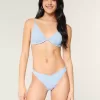Braguita de bikini atrevida con ojales y pierna alta Braguita de bikini atrevida con ojales y pierna alta