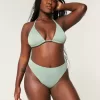Braguita de bikini atrevida, de cintura alta y pierna alta con curvas Braguita de bikini atrevida, de cintura alta y pierna alta con curvas