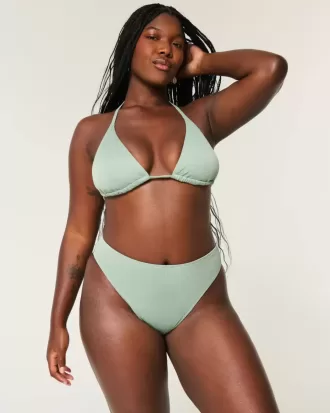 Braguita de bikini atrevida, de cintura alta y pierna alta con curvas