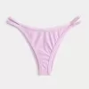 Braguita de bikini atrevida de pierna alta y tiras Braguita de bikini atrevida de pierna alta y tiras