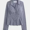Camisa de popelina elástica con botones Camisa de popelina elástica con botones