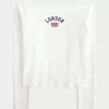 Camiseta gráfica londinense con hombros descubiertos