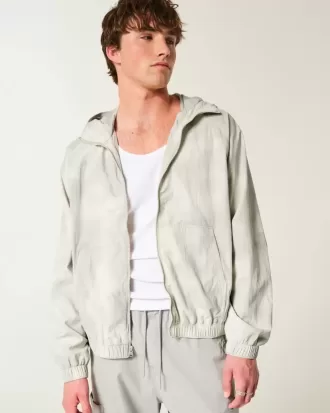 Chaqueta cortavientos con cremallera y estampado de camuflaje