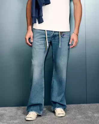 Jeans de corte bota relajados con lavado medio Hermosa