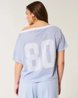 Jersey universitario gráfico de gran tamaño con hombros descubiertos