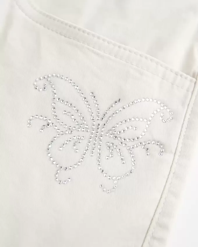 Minifalda de sarga con mariposas y brillo de tiro bajo Minifalda de sarga con mariposas y brillo de tiro bajo