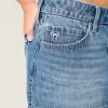 Minifalda vaquera de tiro bajo con lazo bordado Minifalda vaquera de tiro bajo con lazo bordado