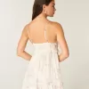 Minivestido con volantes y tachuelas Minivestido con volantes y tachuelas