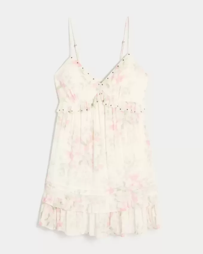 Minivestido con volantes y tachuelas Minivestido con volantes y tachuelas