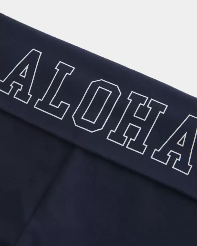 Pantalones acampanados con cintura plegable y estampado gráfico Aloha