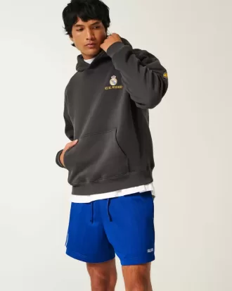 Pantalones cortos de fútbol con logotipo de punto hasta la mitad del muslo