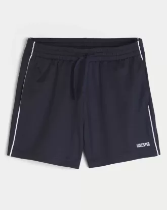 Pantalones cortos de fútbol con logotipo de punto hasta la mitad del muslo