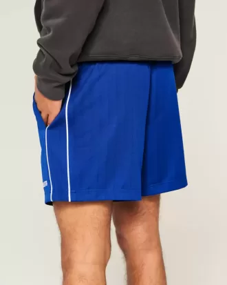Pantalones cortos de fútbol con logotipo de punto hasta la mitad del muslo