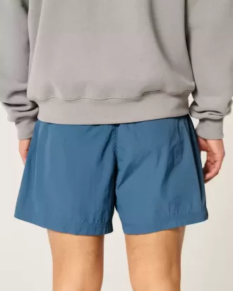 Pantalones cortos de fútbol holgados hasta la mitad del muslo