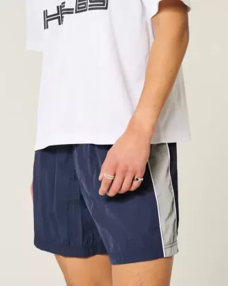 Pantalones cortos de fútbol holgados hasta la mitad del muslo
