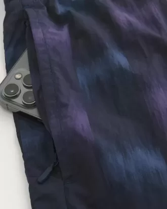 Pantalones cortos deportivos de nailon por encima de la rodilla