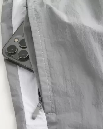 Pantalones cortos deportivos de nailon por encima de la rodilla
