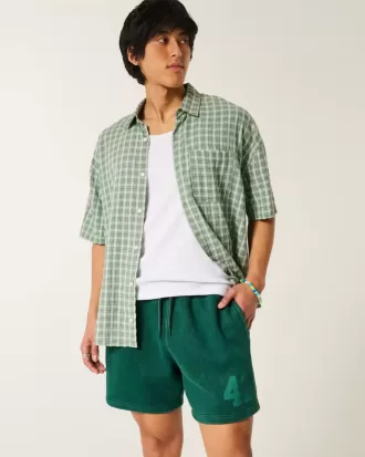 Pantalones cortos holgados de polar con estampado hasta medio muslo