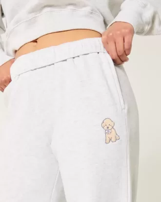 Pantalones deportivos anchos con estampado de perro