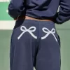 Pantalones deportivos holgados con estampado de lazo Pantalones deportivos holgados con estampado de lazo