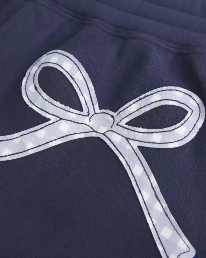 Pantalones deportivos holgados con estampado de lazo Pantalones deportivos holgados con estampado de lazo