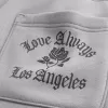 Pantalones deportivos holgados con gráfico de bolsillo trasero de Los Ángeles Pantalones deportivos holgados con gráfico de bolsillo trasero de Los Ángeles
