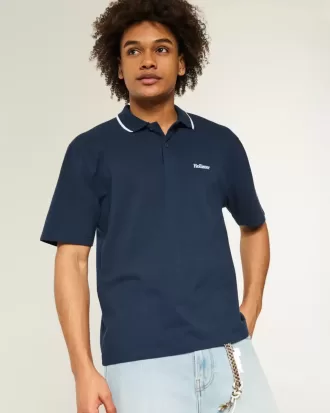 Polo con logotipo relajado