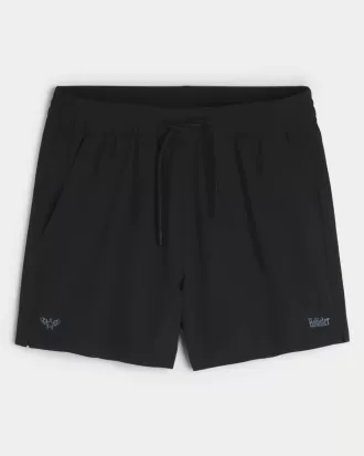 Shorts deportivos con logotipo a medio muslo