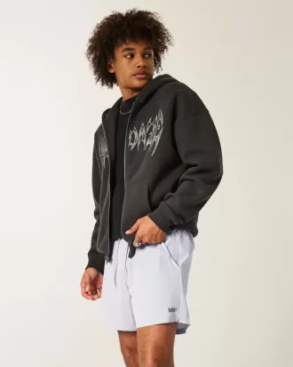 Shorts deportivos con logotipo a medio muslo