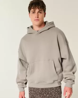 Sudadera con capucha holgada y cintura ajustada