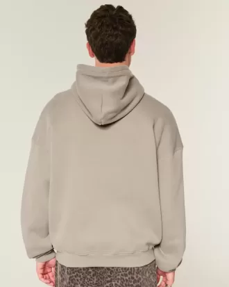 Sudadera con capucha holgada y cintura ajustada