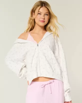 Sudadera con capucha y cremallera con estampado floral de gran tamaño
