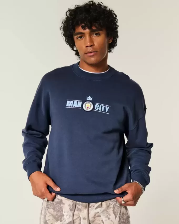 Sudadera con cuello redondo y gráfico del Manchester City FC Sudadera con cuello redondo y gráfico del Manchester City FC