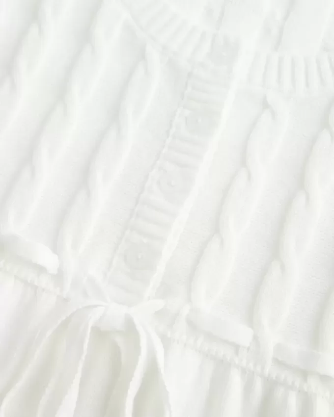 Suéter babydoll de punto trenzado