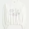 Suéter con cuello redondo y estampado playero de la Costa Oeste