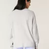 Suéter Hollister Comfy Cloud Bunny con gráfico de cuello redondo Suéter Hollister Comfy Cloud Bunny con gráfico de cuello redondo