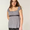 Top babydoll de satén con lazo fácil