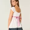 Top babydoll de satén con lazo fácil