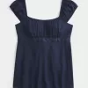 Top babydoll de satén con lazo fácil