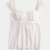 Top babydoll de satén con lazo fácil