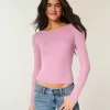 Top de manga larga con cuello oblicuo