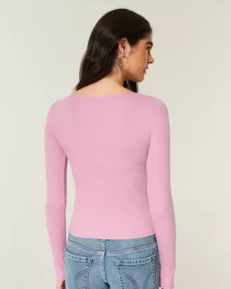 Top de manga larga con cuello oblicuo