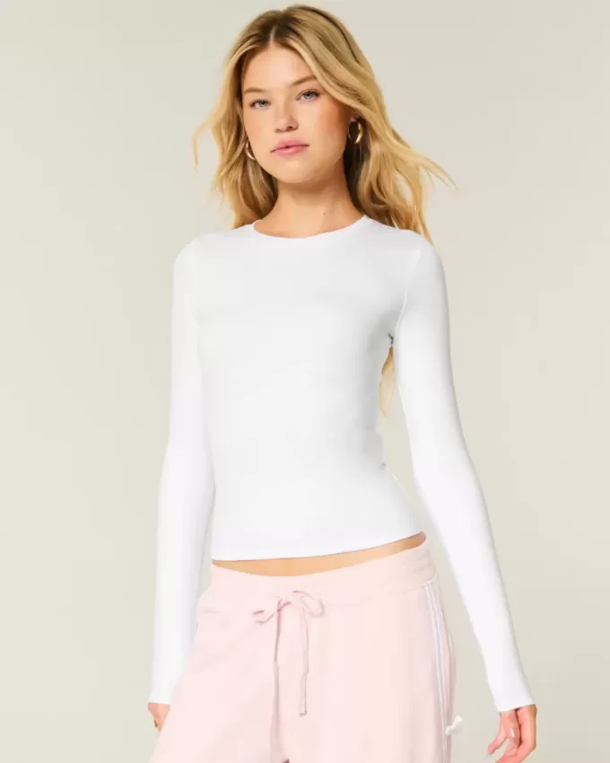 Top de manga larga con cuello redondo y tejido sin costuras Top de manga larga con cuello redondo y tejido sin costuras