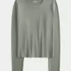Top de manga larga con cuello redondo y tejido sin costuras Top de manga larga con cuello redondo y tejido sin costuras