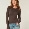 Top de manga larga con cuello redondo y tejido sin costuras Top de manga larga con cuello redondo y tejido sin costuras