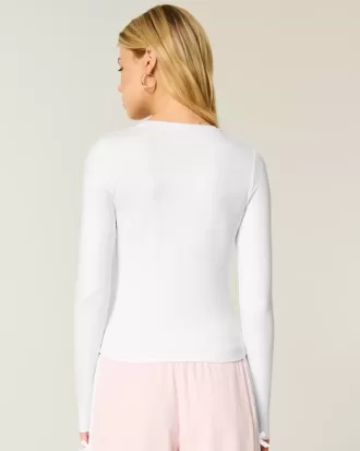 Top de manga larga con cuello redondo y tejido sin costuras Top de manga larga con cuello redondo y tejido sin costuras